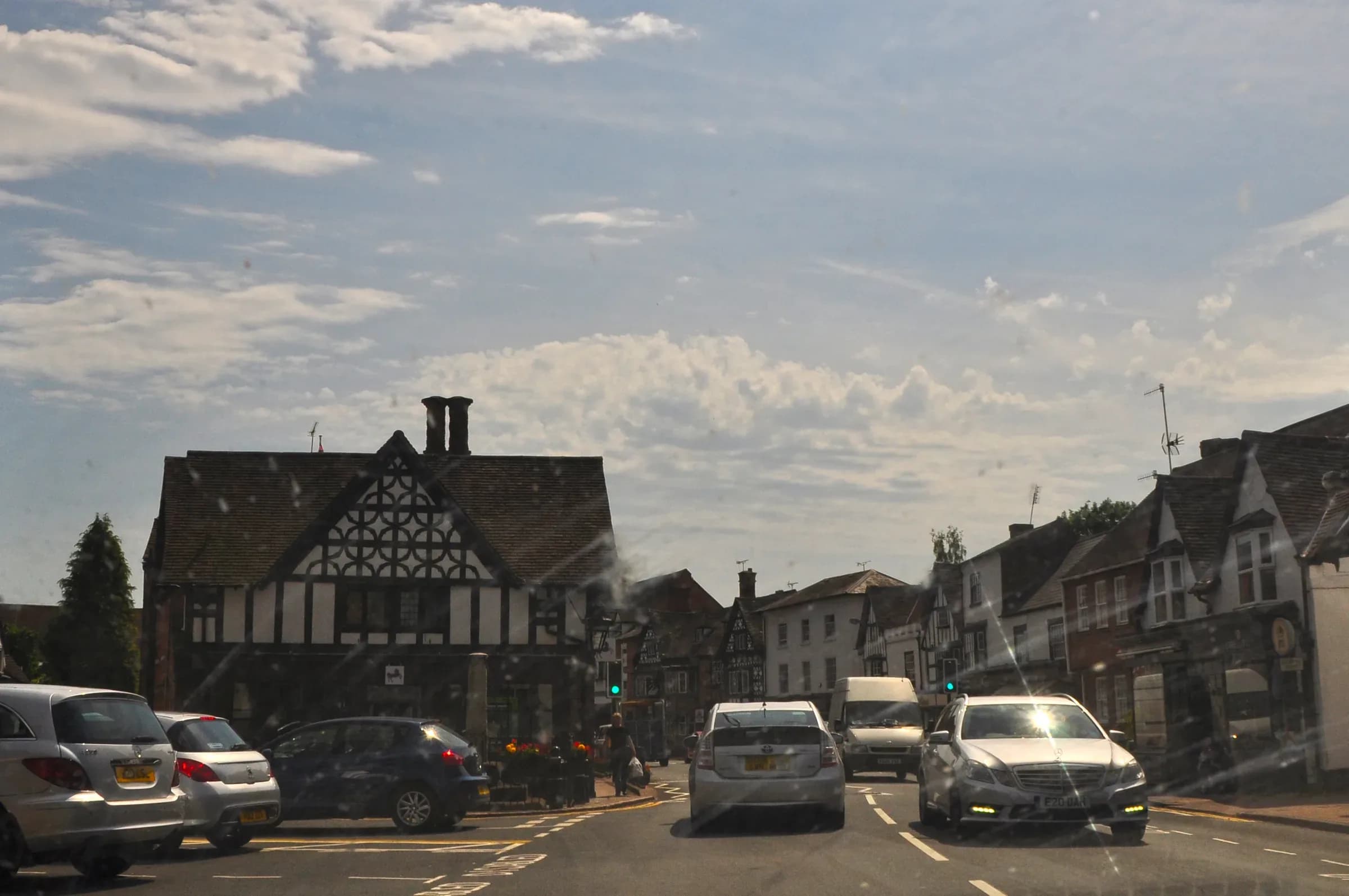 The High Street at Henley-in-Arden, the A3400 running between its timber-framed buildings.